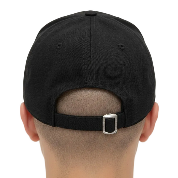 Black cap worn from the back on a white background