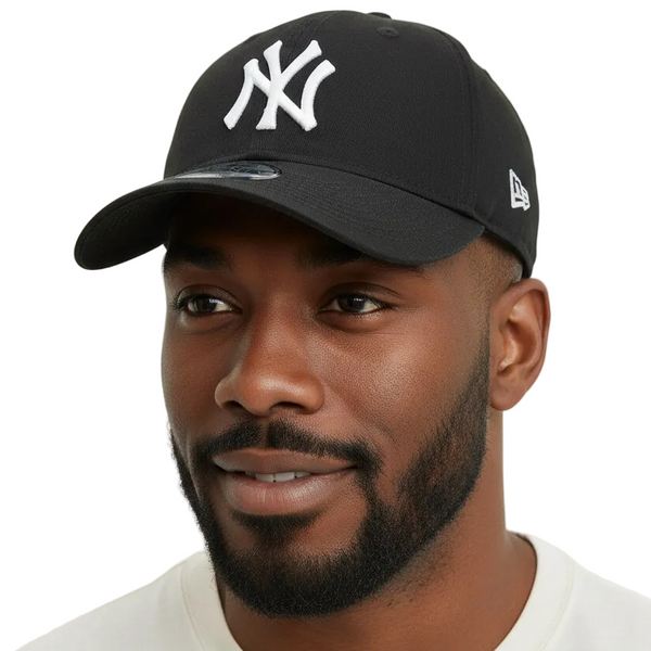 Man wearing a black cap with a logo on a white background